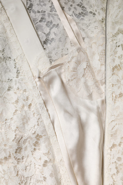 Dolce & Gabbana Weißes Kleid mit geblümter Spitze und langen Ärmeln in A-Linie